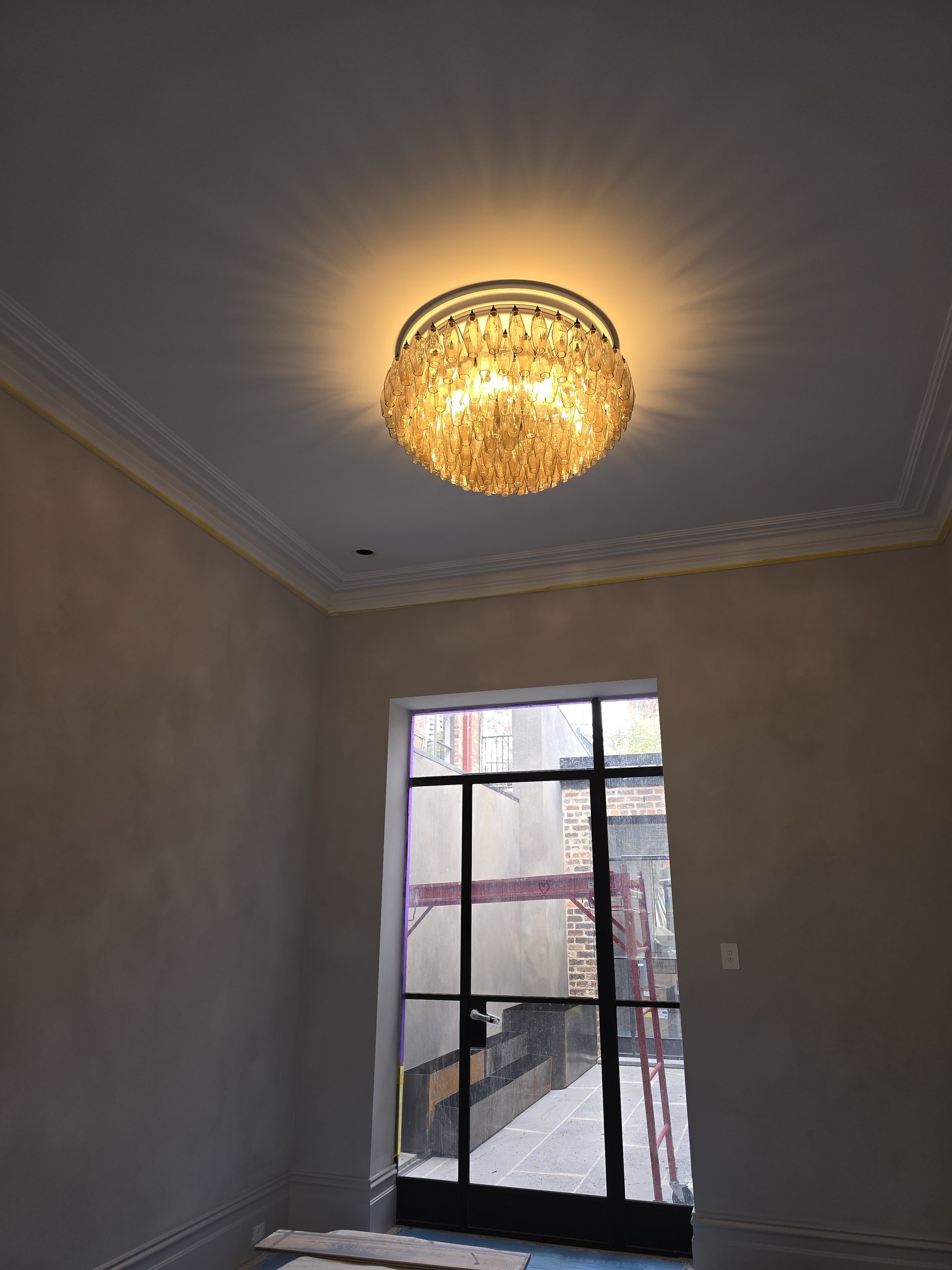 Feature pendant and cornice lighting in a luxury home
